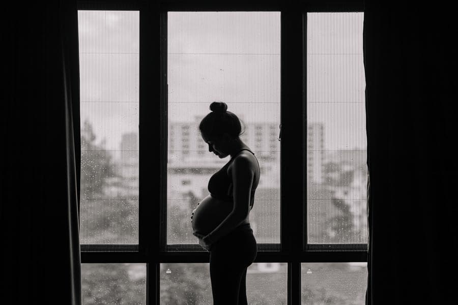 Pregnancy near windows silhouette