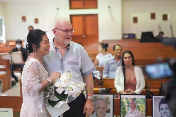 bride and groom looking to tv