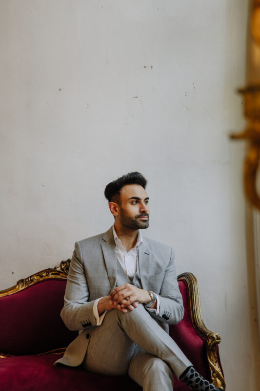 Groom in light grey suit during Bangkok pre wedding photoshoot at Benedict Studio