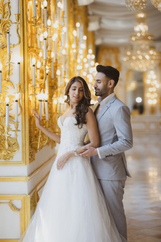 Bride and groom during their pre wedding photoshoot in Bangkok at Benedict Studio golden candlelit hall